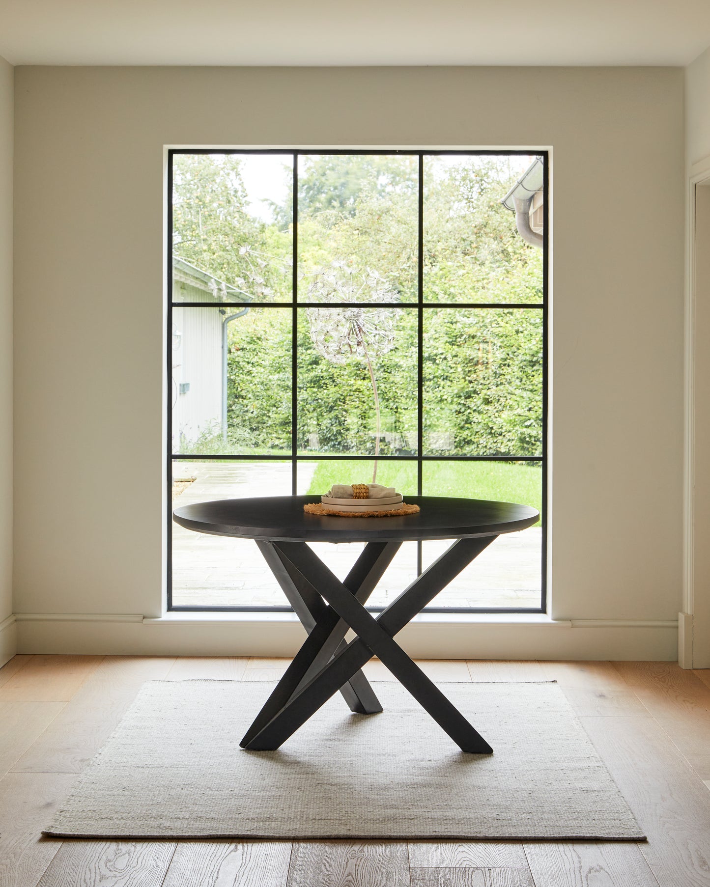 Levi Black Round Dining Table Set - 4 Seater - Freya Fern Green Armchairs with Black Legs