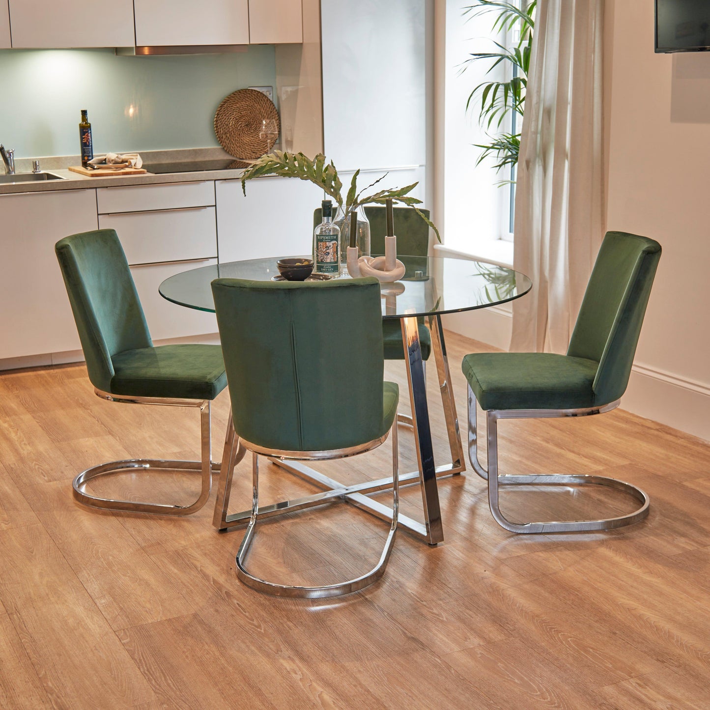 Clara Glass Dining Table Set - 4 Seater - Lola Green Dining Chairs with Chrome Legs - Laura James