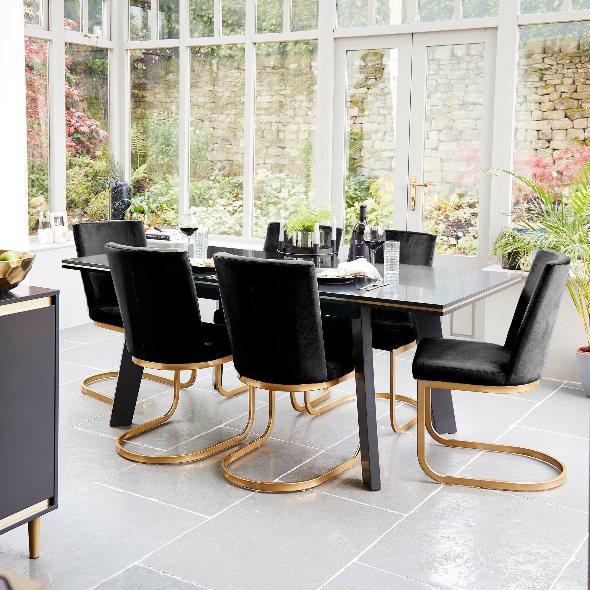 Black dining table with gold legs sale