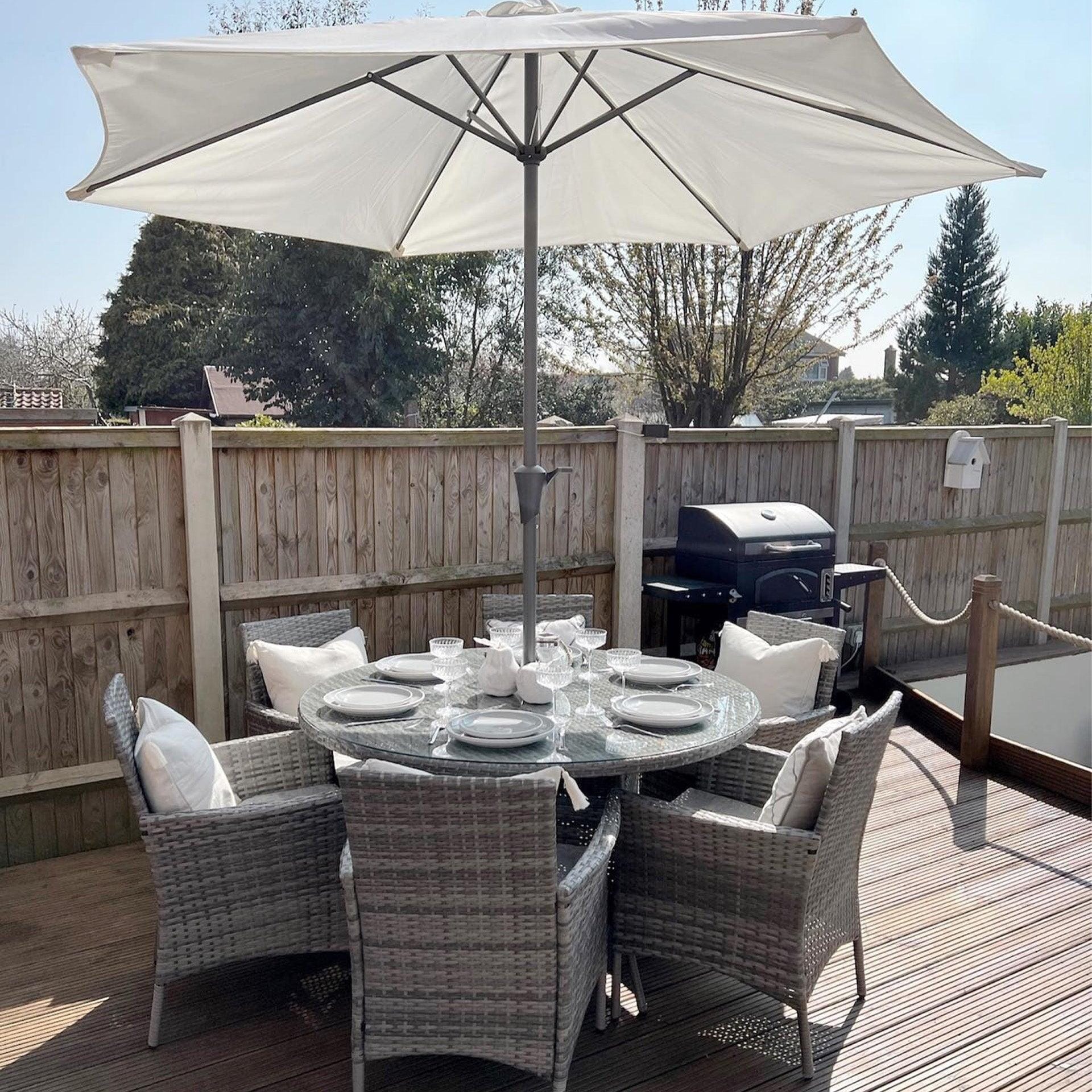 Kemble 6 Seater Rattan Round Dining Set with Cream LED Premium Parasol Parasol Rain Cover Grey Weave