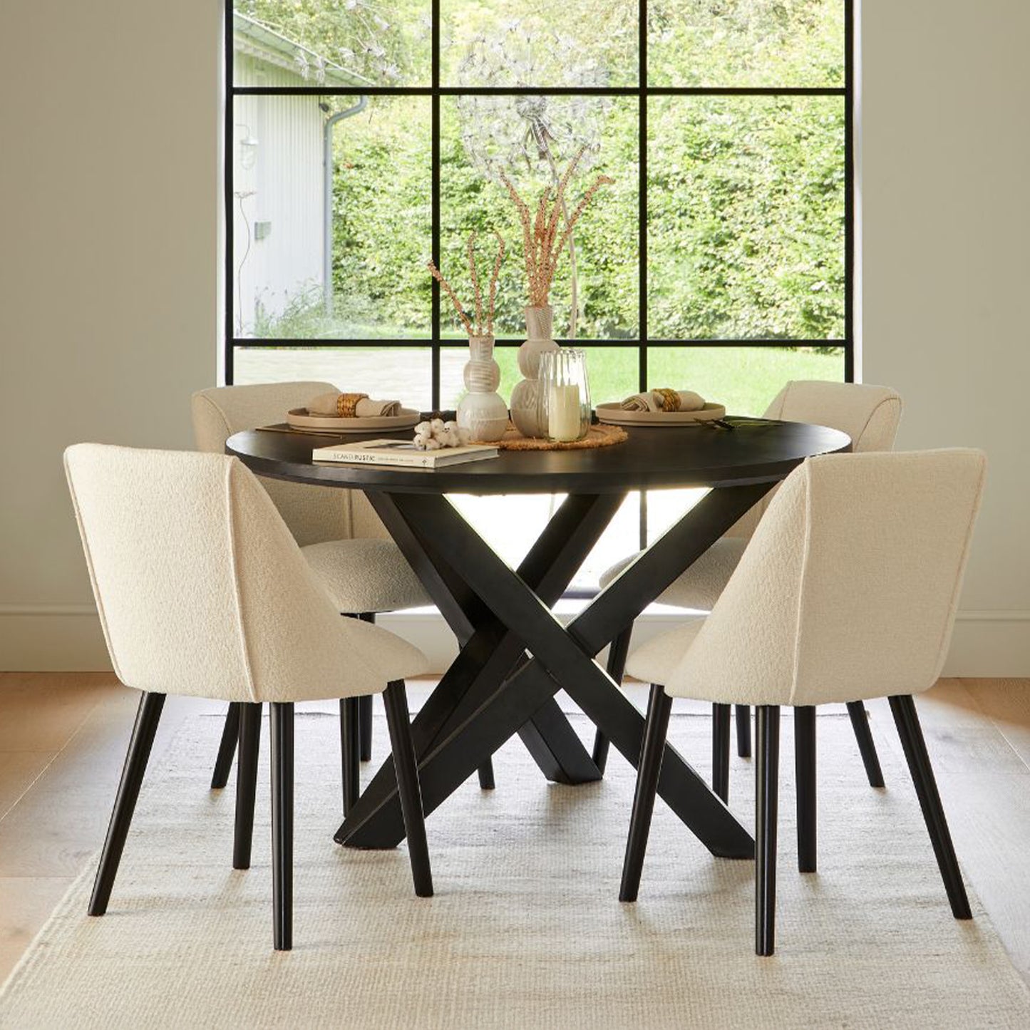 Levi Black Round Dining Table Set - 4 Seater - Freya Boucle Dining Chairs with Black Legs