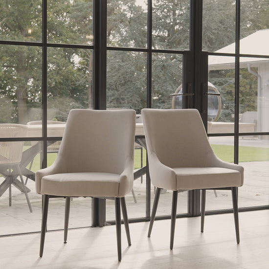 Maeve-soft-beige-dining-chairs-black-legs-video