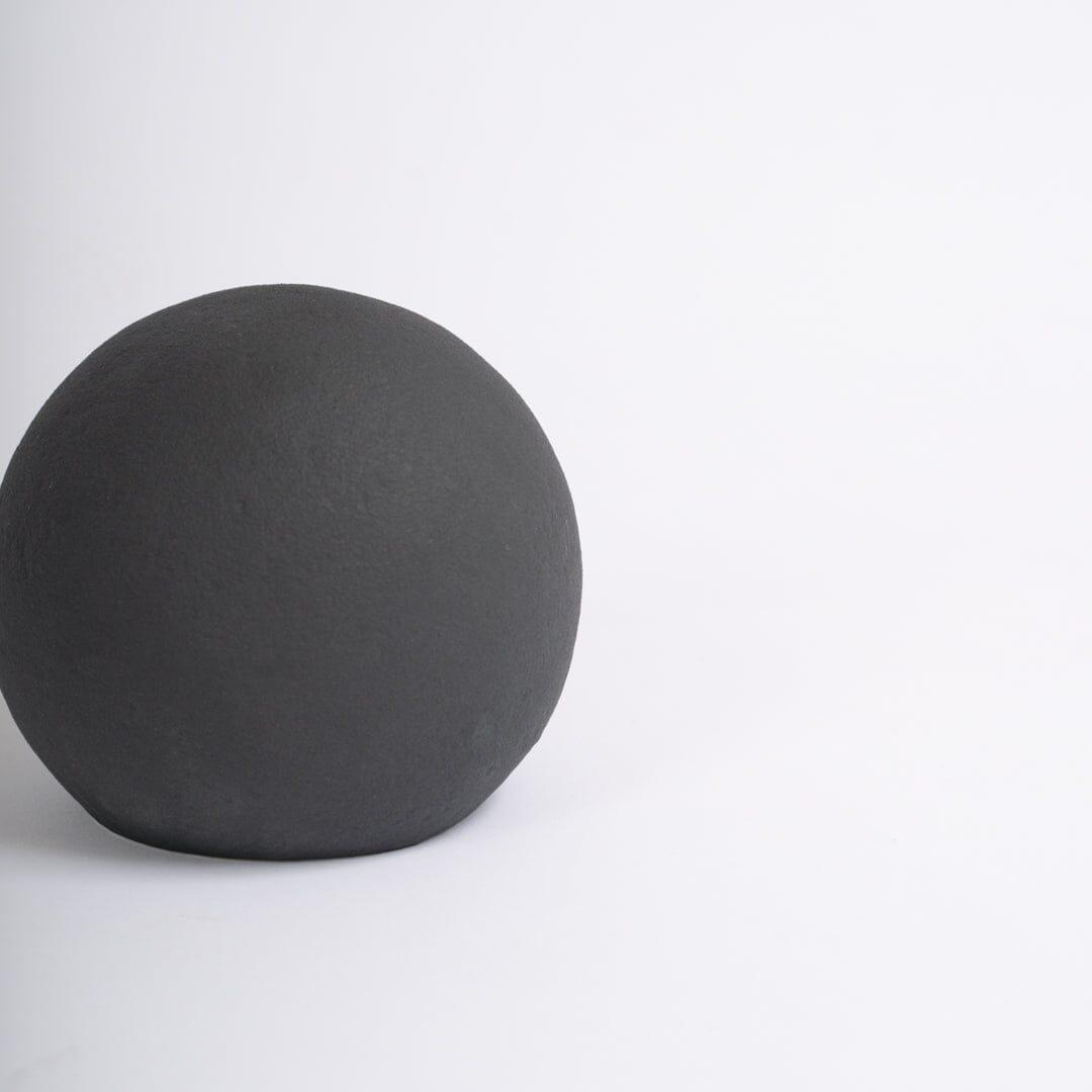 Large black ceramic ball decoration - Laura James