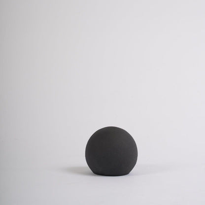 Large black ceramic ball decoration - Laura James]